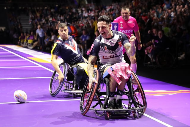 MANCHESTER, ENGLAND - NOVEMBER 18: Lewis King of England celebrates their sides third try during the Wheelchair Rugby League World Cup Final match between France and England at Manchester Central on November 18, 2022 in Manchester, England. (Photo by Charlotte Tattersall/Getty Images for RLWC)