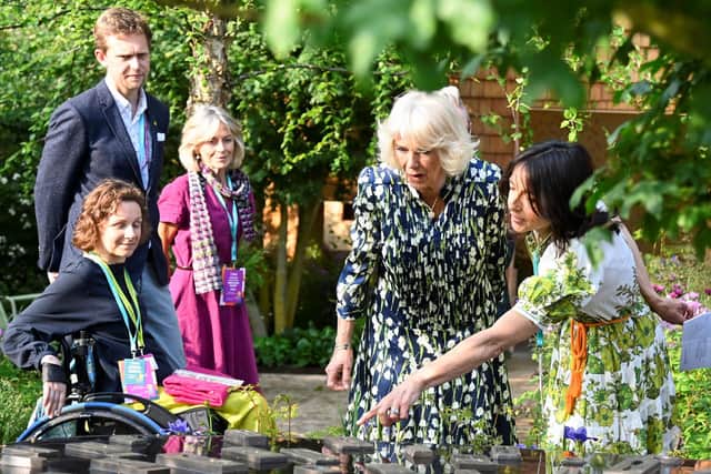 Britain's Queen Camilla views Horatio's Garden during a visit to the 2023 RHS Chelsea Flower Show in London on May 22, 2023. The Chelsea flower show is held annually in the grounds of the Royal Hospital Chelsea. (Photo by TOBY MELVILLE / POOL / AFP) (Photo by TOBY MELVILLE/POOL/AFP via Getty Images)