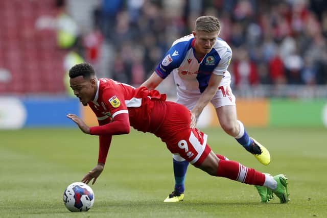 Middlesbrough's Rodrigo Muniz Carvalho and Blackburn Rovers' Scott Wharton battle for the ball during the Sky Bet Championship match at the Riverside Stadium, Middlesbrough. Picture: Will Matthews/PA Wire.