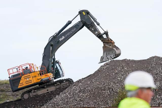 Plant machinery operates during a ceremony to mark the ground-breaking of the Net Zero Teesside project on September 27, 2023 in Redcar, England. (Photo by Ian Forsyth/Getty Images)