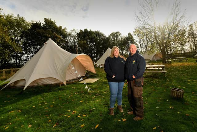 Jonathan and Catherine Hodgson pictured with the glamping tents