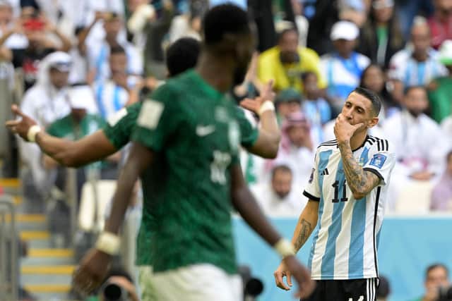 Argentina's midfielder #11 Angel Di Maria (R) reacts during the Qatar 2022 World Cup Group C football match between Argentina and Saudi Arabia at the Lusail Stadium in Lusail, north of Doha on November 22, 2022. (Photo by JUAN MABROMATA / AFP) (Photo by JUAN MABROMATA/AFP via Getty Images)