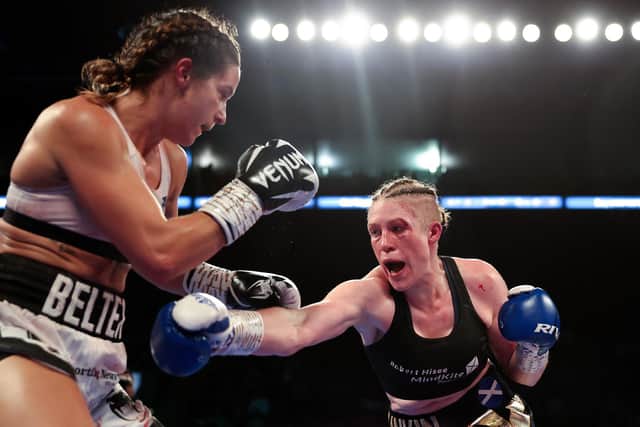NOTTINGHAM, ENGLAND - SEPTEMBER 24: Hannah Rankin punches Terri Harper during the WBA and IBO World Super Welterweight title fight between Hannah Rankin and Terri Harper at Motorpoint Arena Nottingham on September 24, 2022 in Nottingham, England. (Photo by Nathan Stirk/Getty Images)