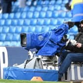 LEEDS, ENGLAND - MARCH 11: A TV Camera Operator looks on prior to the Premier League match between Leeds United and Brighton & Hove Albion at Elland Road on March 11, 2023 in Leeds, England. (Photo by Stu Forster/Getty Images).