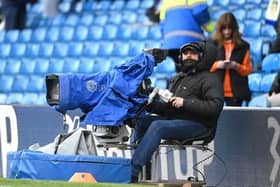 LEEDS, ENGLAND - MARCH 11: A TV Camera Operator looks on prior to the Premier League match between Leeds United and Brighton & Hove Albion at Elland Road on March 11, 2023 in Leeds, England. (Photo by Stu Forster/Getty Images).