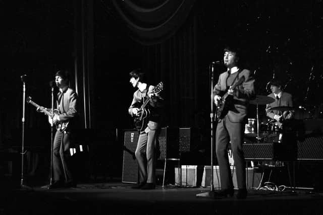 The Beatles on stage, pictured by John Varley.