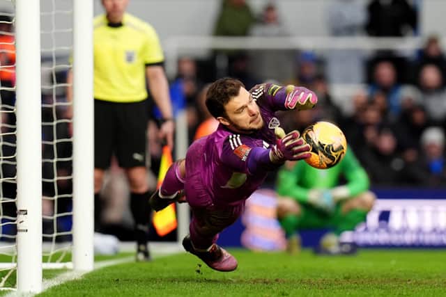 BRUM DEAL: Lucas Perri saves Tommy Doyle's penalty in the fourth-round shoot-out at Birmingham City (Image: Jacob King/PA Wire)