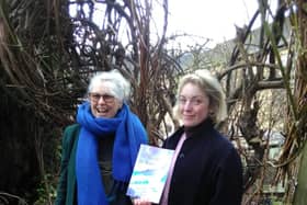 India, on the right, with the author Pam Pottinger, shows off her new book