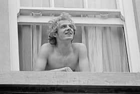 Welsh footballer Terry Yorath looks out of his hotel room before the 1973 FA Cup final at the end of his breakthrough season as a Leeds United midfielder (Photo by Evening Standard/Hulton Archive/Getty Images)