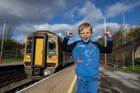 Train enthusiast Billy Thompson 6, , at his local train Station at Moorthorpe near South Elmsall