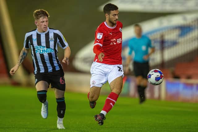 Ziyad Larkeche holds off Jay Turner-Cooke in Barnsley FC's EFL Trophy game with Newcastle U21. Picture: Bruce Rollinson