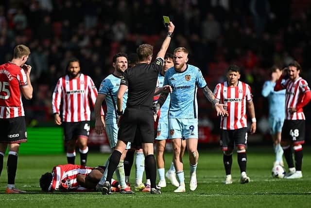 ANGRY: Oli McBurnie questions John Lundstram's second yellow card (Image: Mark Sutton/Getty Images)