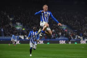 Huddersfield Town striker Joe Taylor leaps high after scoring his side's third goal against former club Peterborough United on Tuesday night. Picture: Jonathan Gawthorpe