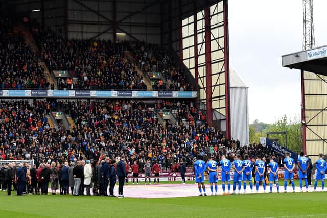 RESPECTS: A minute's silence is observed for the victims of the Bradford fire disaster during the season-ending League Two encounter between Bradford City and Leyton Orient. Picture: Simon Hulme