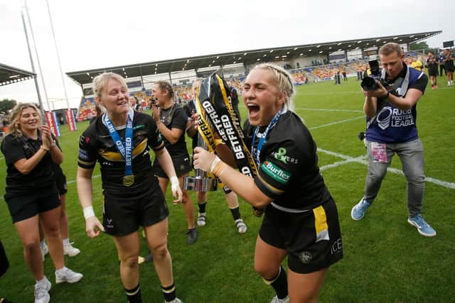 York Valkyrie's Sinead Peach celebrates with the Betfred Women’s Super League trophy after they beat Leeds Rhinos in the Grand Final (Picture: Ed Sykes/SWpix.com)