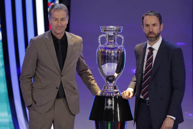 Denmark's head coach Kasper Hjulmand and England's football manager Gareth Southgate of Group C pose next to the trophy after the final draw for the UEFA Euro 2024 European Championship (Picture: ODD ANDERSEN/AFP via Getty Images)
