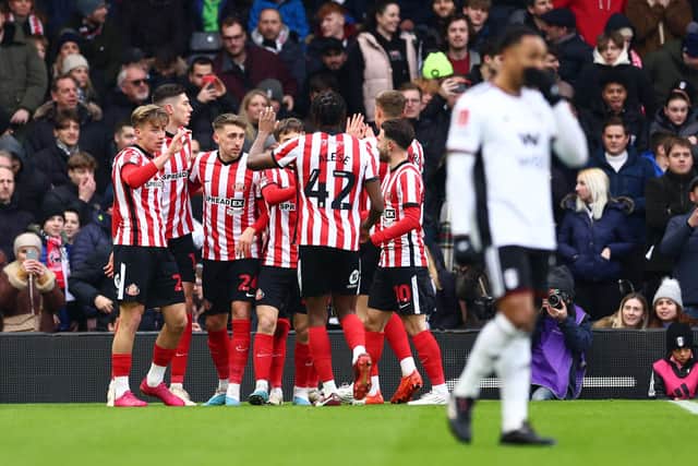 LONDON, ENGLAND - JANUARY 28: Jack Clarke of Sunderland celebrates with teammates after scoring the team's first goal during the Emirates FA Cup Fourth Round match between Fulham and Sunderland at Craven Cottage on January 28, 2023 in London, England. (Photo by Clive Rose/Getty Images)
