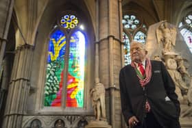 Artist David Hockney poses in front of The Queen's Window, a new stained glass window at Westminster Abbey he designed and which was created by Barley Studio York, as it is revealed for the first time on September 26, 201 (Photo by Victoria Jones - WPA Pool/Getty Images)