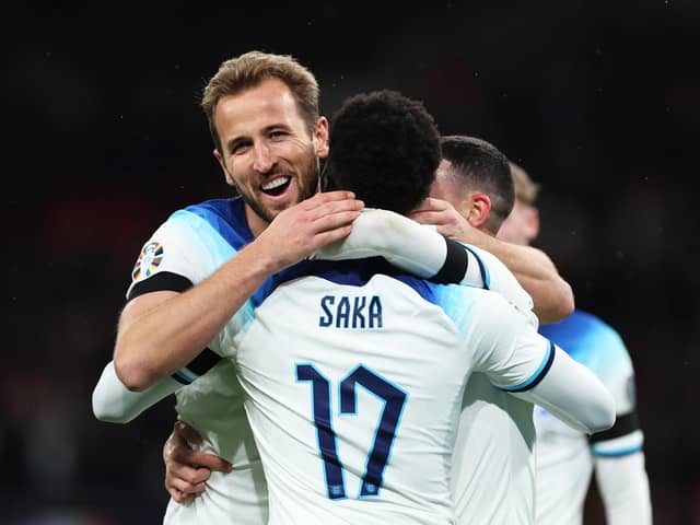 Harry Kane of England (L) celebrates with teammates Bukayo Saka (C) and Phil Foden after scoring during England's Euro 2024 qualifying campaign (Picture: Catherine Ivill/Getty Images)