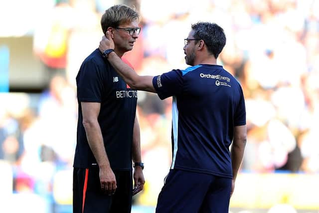 LEARNING EXPERIENCE:  David Wagner (right) was able to add some of what he had learnt from Jurgen Klopp (left) when he took his first head coach job at Huddersfield Town