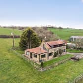 This privately situated residential smallholding is set in a sheltered location and has lovely views.