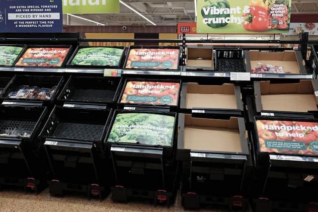 Empty fruit and vegetable shelves at an Asda in east London earlier this year. PIC: PA