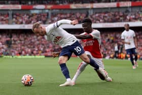 English superstars: James Maddison of Tottenham Hotspur is challenged by Bukayo Saka of Arsenal as they both produced top-class performances that makes Gareth Southgate's job even harder (Picture: Alex Pantling/Getty Images)