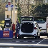 People dispense fuel at the pump. PIC: PA