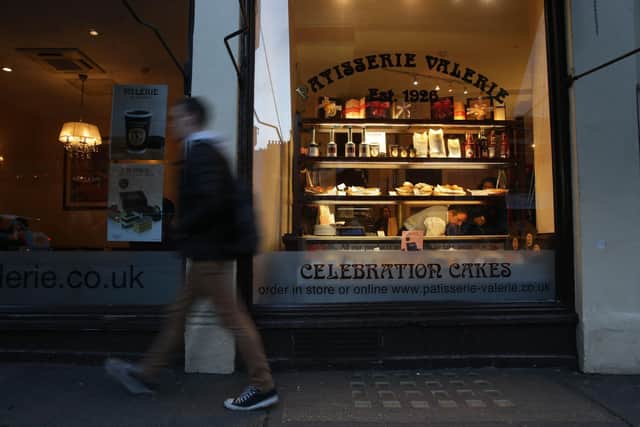 A pedestrian walks past a branch of a Patisserie Valerie cafe in London on January 23, 2019. (Photo by DANIEL LEAL/AFP via Getty Images)