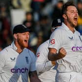 England's Ollie Robinson (2R) celebrate after taking the wicket of Pakistan's Salman Ali Agha (not pictured) during the fifth and final day of the first cricket Test match between Pakistan and England at the Rawalpindi Cricket Stadium (Picture: AAMIR QURESHI/AFP via Getty Images)
