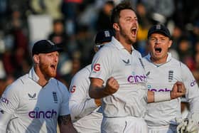 England's Ollie Robinson (2R) celebrate after taking the wicket of Pakistan's Salman Ali Agha (not pictured) during the fifth and final day of the first cricket Test match between Pakistan and England at the Rawalpindi Cricket Stadium (Picture: AAMIR QURESHI/AFP via Getty Images)