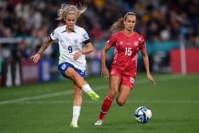 On the up: Rachel Daly of England, left, takes the ball past Frederikke Thogersen of Denmark during the Lionesses' 1-0 win in Sydney on Friday, a game that came at a cost for the European champions (Picture: Justin Setterfield/Getty Images)