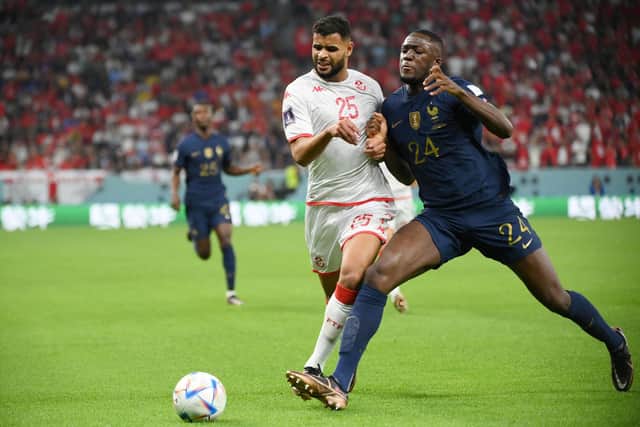 Tunisia midfielder and new Sheffield United signing Anis Ben Slimane (L) fights for the ball with France defender Ibrahima Konate (R) during the Qatar 2022 World Cup Group D match between Tunisia and France at the Education City Stadium in Al-Rayyan, west of Doha on November 30, 2022. Photo by FRANCK FIFE/AFP via Getty Images)