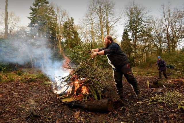 Ben Paterson is pictured clearing branches to burn. Picture by Simon Hulme