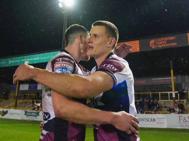 Innes Senior of Castleford celebrates his teams first victory of the 2024 season against the Salford Red Devils with Sam Wood of Castleford (Picture: Olly Hassell/SWPix.com)