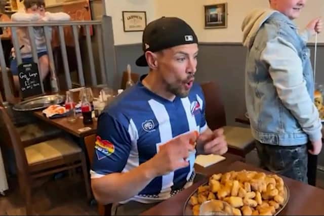 Video grab shows 'extreme eaters' taking on two food challenge records - scoffing a 60oz burger and 100 chicken nuggets.