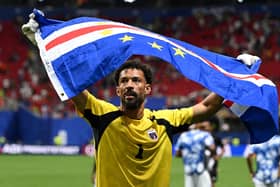 Cape Verde's goalkeeper #01 Vozinha celebrates with his national flag at the end of the 2026 World Cup Group H football match between Spain and Cape Verde at the Atlanta Stadium in Atlanta on June 15, 2026. (Photo by ROBERTO SCHMIDT / AFP via Getty Images)