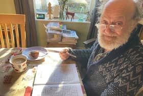 Ian Fellows during his retirement completing a crossword.