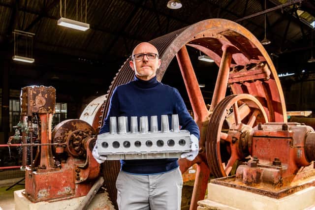 John McGoldrick, Curator of Industrial History at the museum holding a cast aluminium cylinder head for a LandRover. Picture By Yorkshire Post Photographer,  James Hardisty.