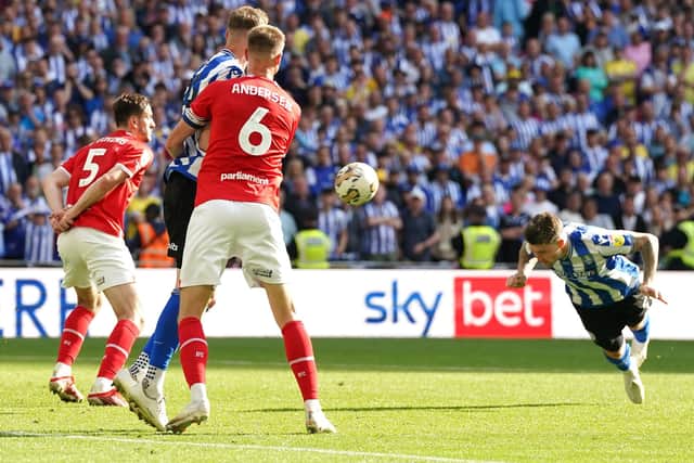 KILLER BLOW: Sheffield Wednesday's Josh Windass (right) pounces with just seconds of extra time remaining to head home the goal that defeated Barnsley 1-0 in the League One play-off final at Wembley Stadium Picture: Nick Potts/PA