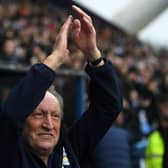 RETURNING HERO: Huddersfield Town manager Neil Warnock salutes the crowd at the start of his second spell with the club