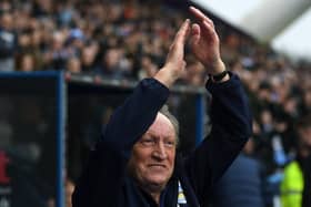 RETURNING HERO: Huddersfield Town manager Neil Warnock salutes the crowd at the start of his second spell with the club