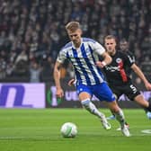 New Huddersfield Town signing Bojan Radulovic, in the colours of HJK Helsinki, challenges Ellyes Skhiri of Eintracht Frankfurt during the UEFA Europa Conference League match in October 2023. Photo: Christian Kaspar-Bartke/Getty Images.