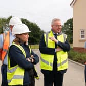 Prime Minister Rishi Sunak and Michael Gove, Minister for Levelling Up, Housing and Communities, speak to a Trainee Assistant Site Manager during a visit to a Taylor Wimpey housing development. PIC: Joe Giddens/PA Wire