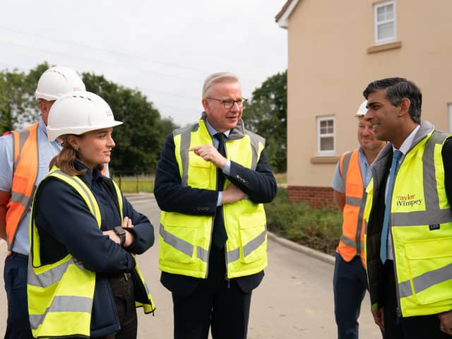 Prime Minister Rishi Sunak and Michael Gove, Minister for Levelling Up, Housing and Communities, speak to a Trainee Assistant Site Manager during a visit to a Taylor Wimpey housing development. PIC: Joe Giddens/PA Wire