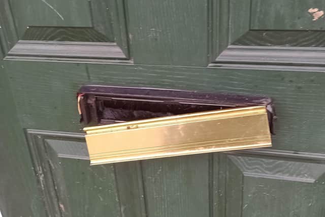 Damage to the letterbox at the house