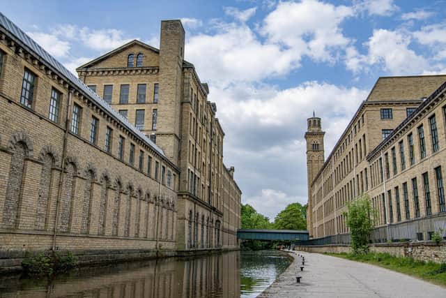 Salts Mill and New Mill by the Leeds Liverpool Canal, photographed by Tony Johnson for The Yorkshire Post.  26th May 2023