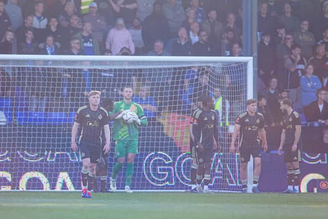 Shell-shocked FC Halifax Town players pictured after conceding a second goal to a rampant Oldham side at Boundary Park. Photo: Tony Johnson.