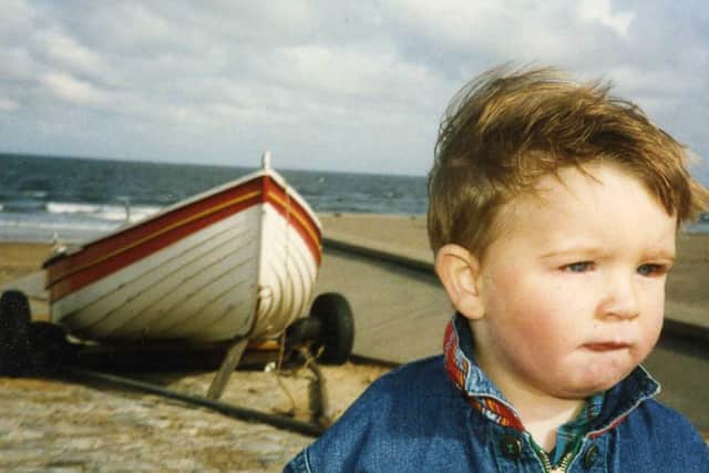 A photograph of Cory McLeod from Starbeck at the seaside as a toddler  one of the 7,500 images taken of him by his father Ian 