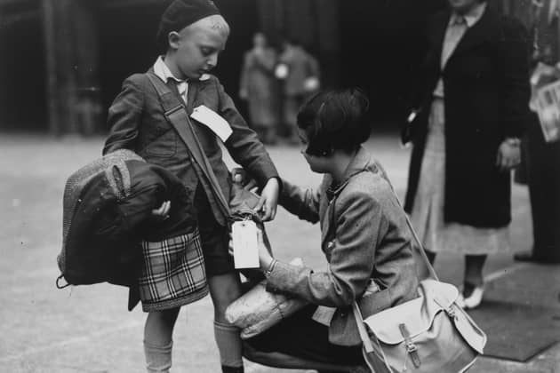 London schoolchildren checking their labels before leaving the city on evacuation to the countryside.